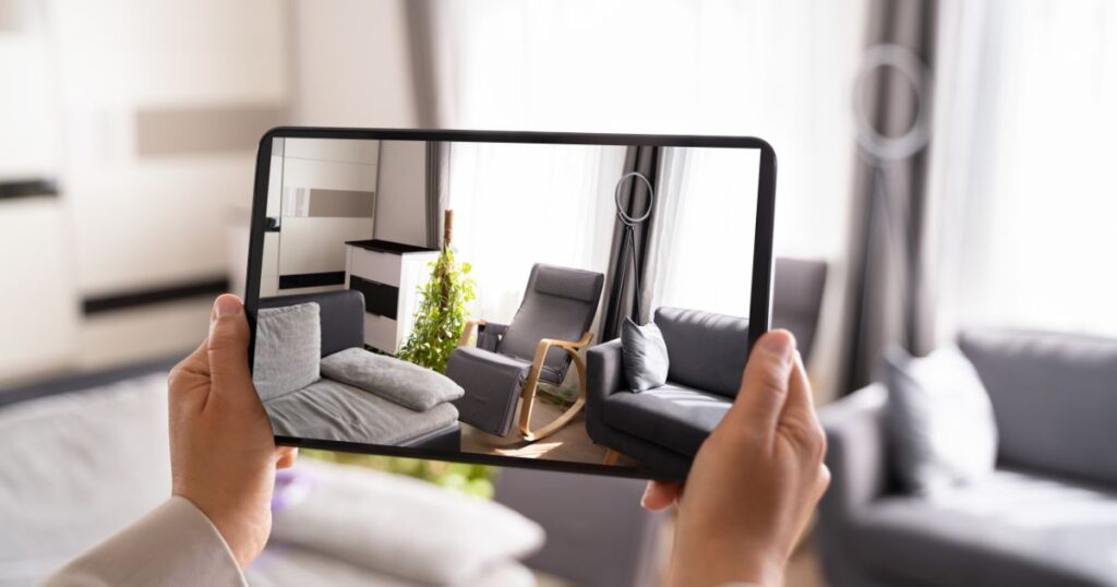 Unidentified woman using a tablet or iPad to record media of a room for a listing.