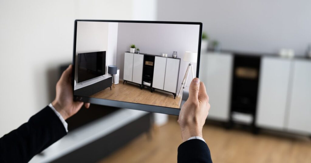 Unidentified man using a tablet to record property listing media.